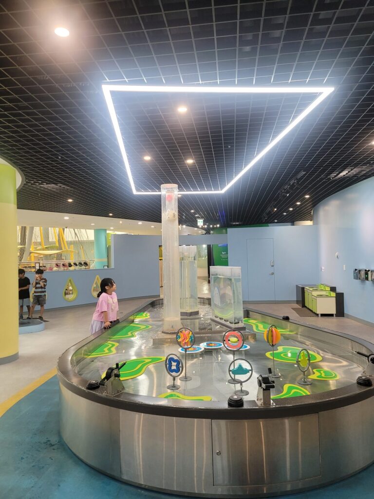 Circular water play table with a water wheel at Goyang Children's Museum