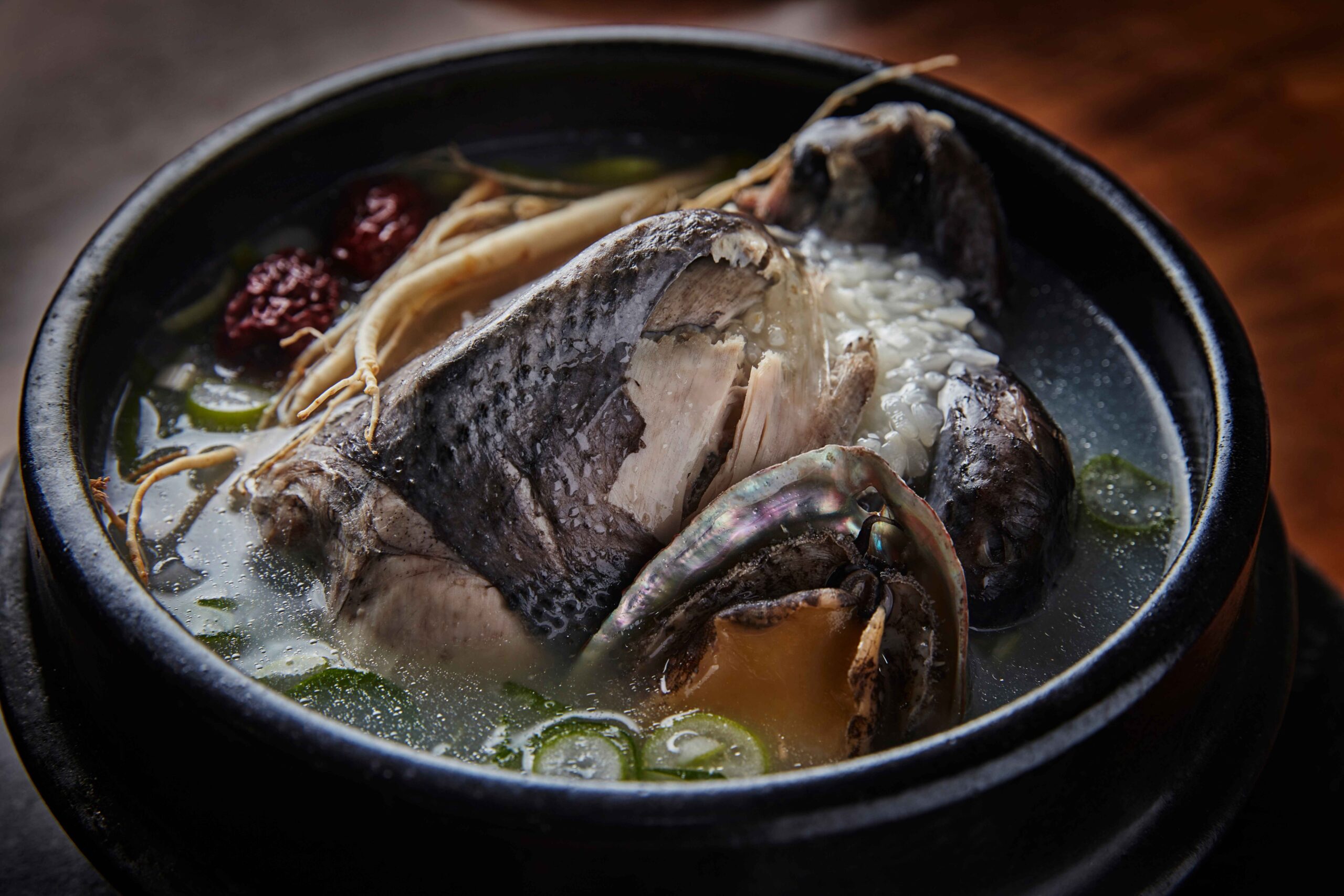 A bowl of samgyetang, Korean whole chicken soup with ginseng and rice
