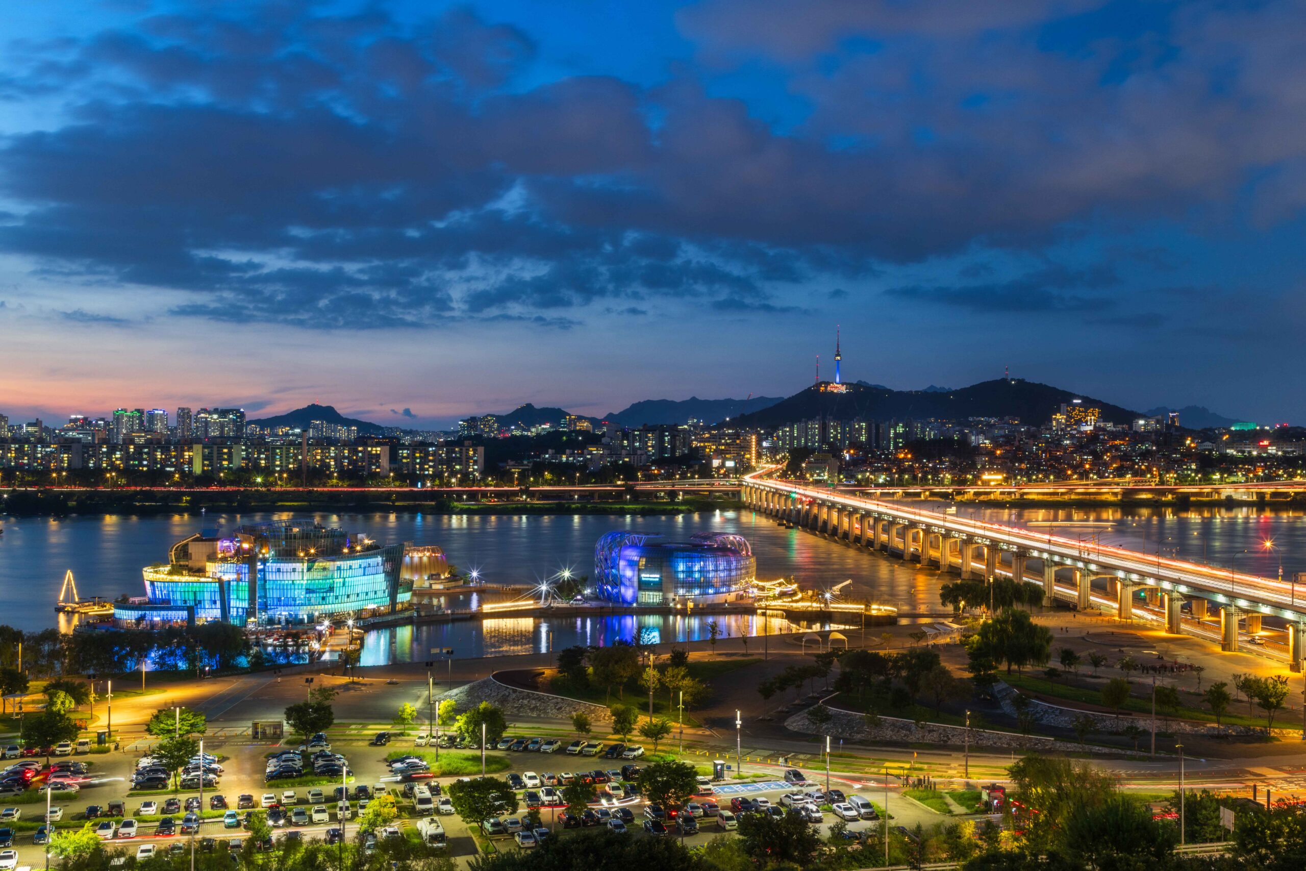 Seoul city lights at night seen from Namsan, with N Seoul Tower above